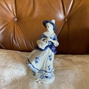 Porcelain Vintage Victorian lady figurine. Decorated with Blue, white and gold.